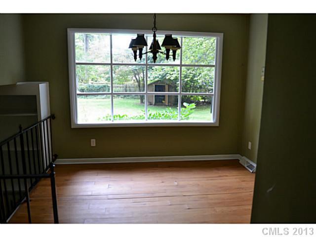 1447 McIlroy Road Charlotte, NC 28212 - Photo 9 of 12 a view of wooden floor and windows in a room