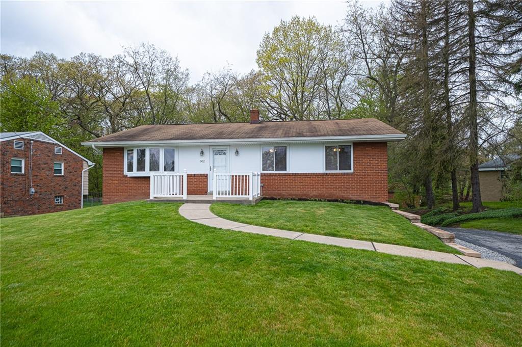 WELCOME TO 602 FLINT ROAD IN SHALER TOWNSHIP:  New brick wall lines your driveway.  Annual flowers have been added to flower patches and ready for summer. 