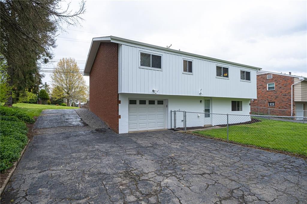 602 Flint Road Allison Park, PA 15101 - Photo 2 of 25 BACK OF HOUSE: View the back of your home that has been freshly painted on the bottom & top. Plenty of off street parking for all your family and guests.