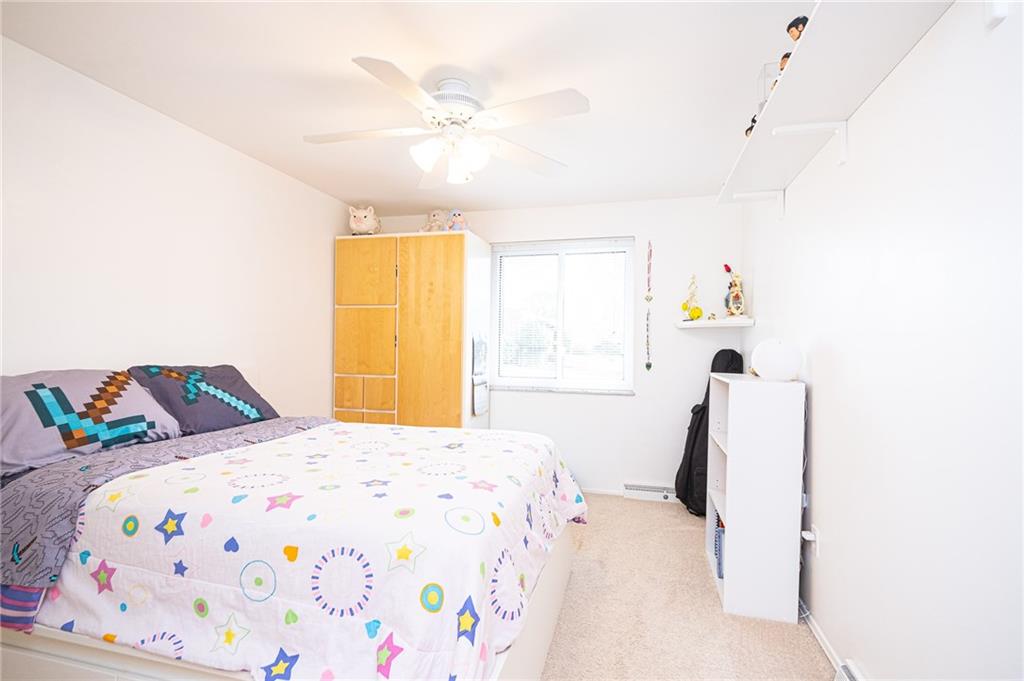 602 Flint Road Allison Park, PA 15101 - Photo 18 of 25 2ND BEDROOM 12X10: Spacious room includes a ceiling fan & added wall shelves for your personal favorite things.