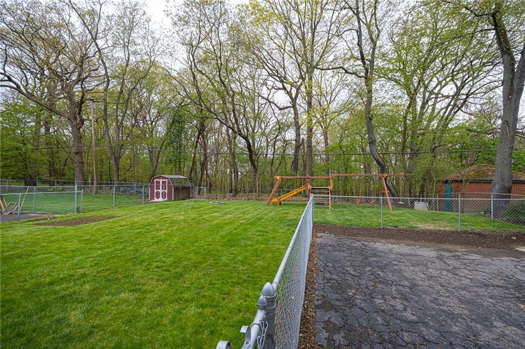 602 Flint Road Allison Park, PA 15101 - Photo 3 of 25 VIEW OF BACK YARD: View of your back yard that is completely level and fenced in. View of the woods behind your yard.