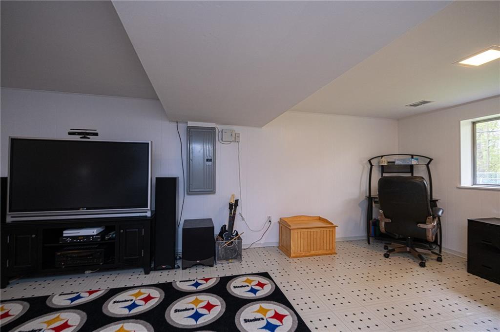 602 Flint Road Allison Park, PA 15101 - Photo 8 of 25 GAME ROOM 26X15: Another view of the game room and newer electric panel.