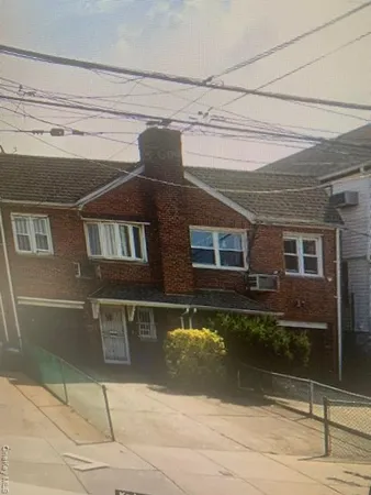 a view of a brick house with a outdoor space
