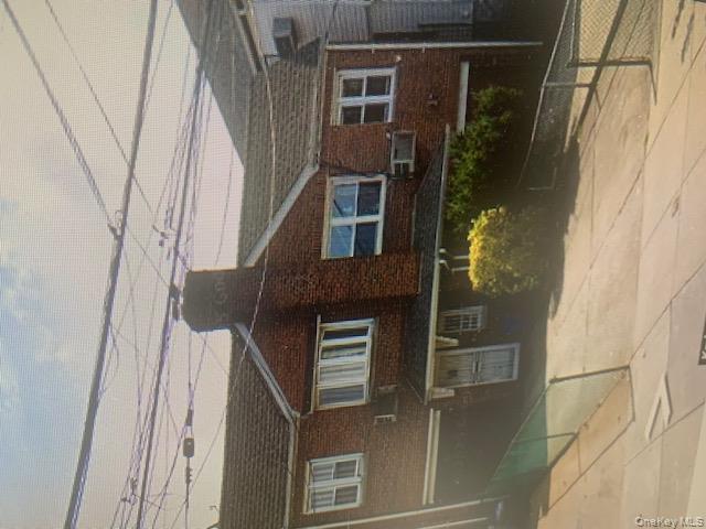 a view of a brick house with a outdoor space