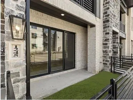 a view of a balcony and a door of the house