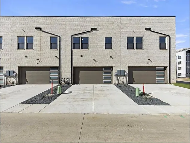 a front view of a house with a garage