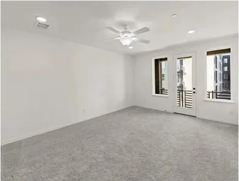 a large kitchen with stainless steel appliances granite countertop a large stove a sink dishwasher and a refrigerator with wooden floor