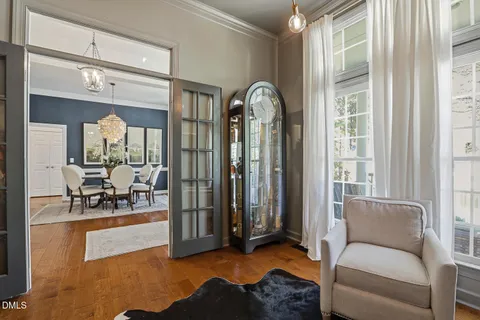 a dining room with furniture a rug and wooden floor