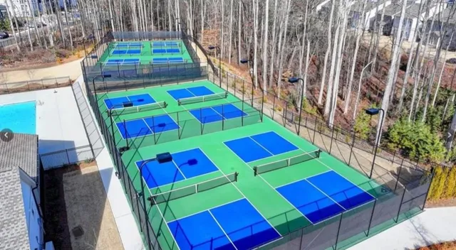 a room that has a bed and a wooden floor