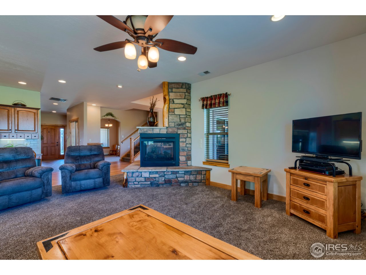 1456 Red Tail Road Eaton, CO 80615 - Photo 11 of 40 Multi-Sided Fireplace