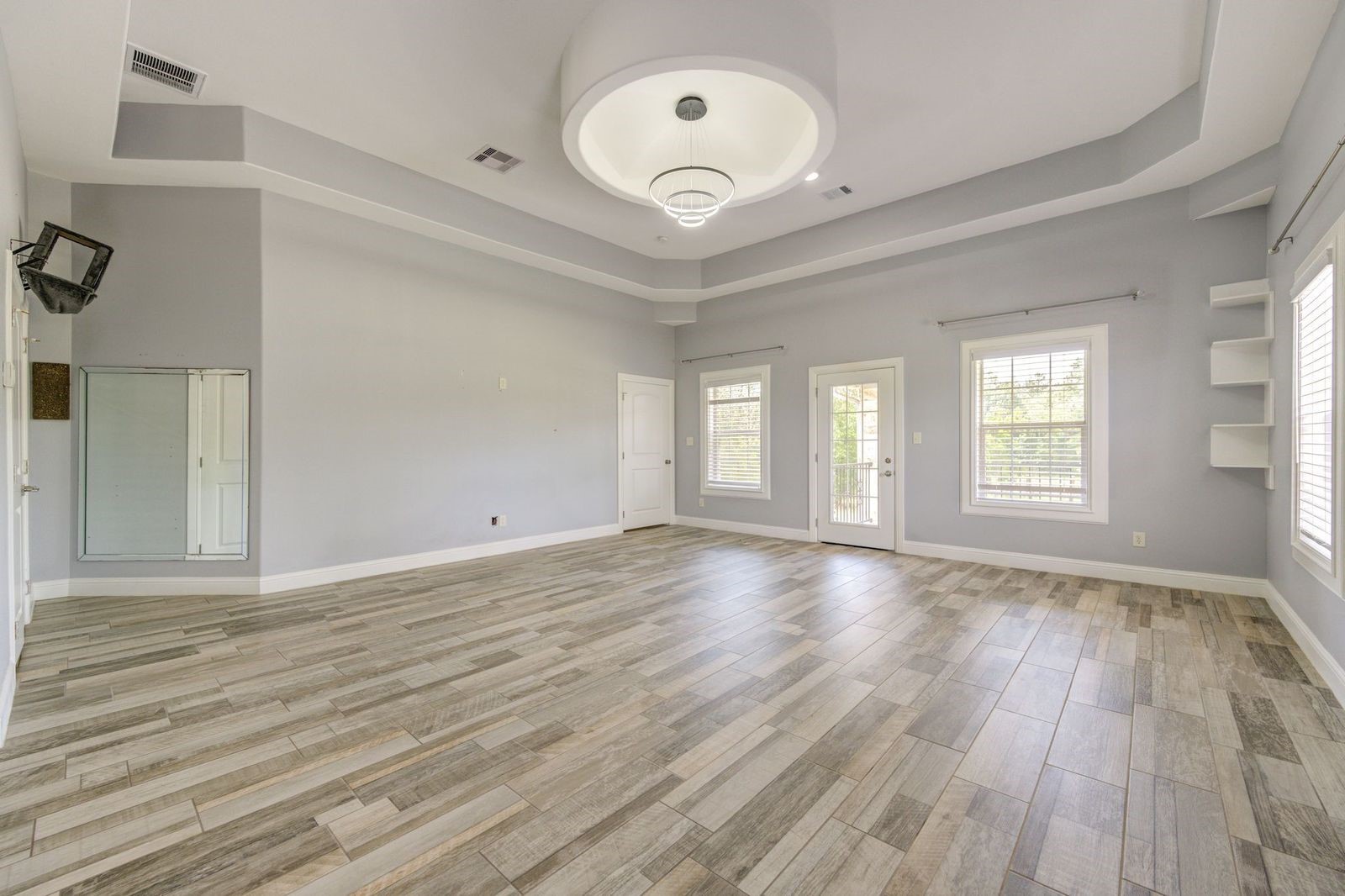 21038 Angus Drive Cleveland, TX 77328 - Photo 41 of 49 a view of an empty room with wooden floor and a window