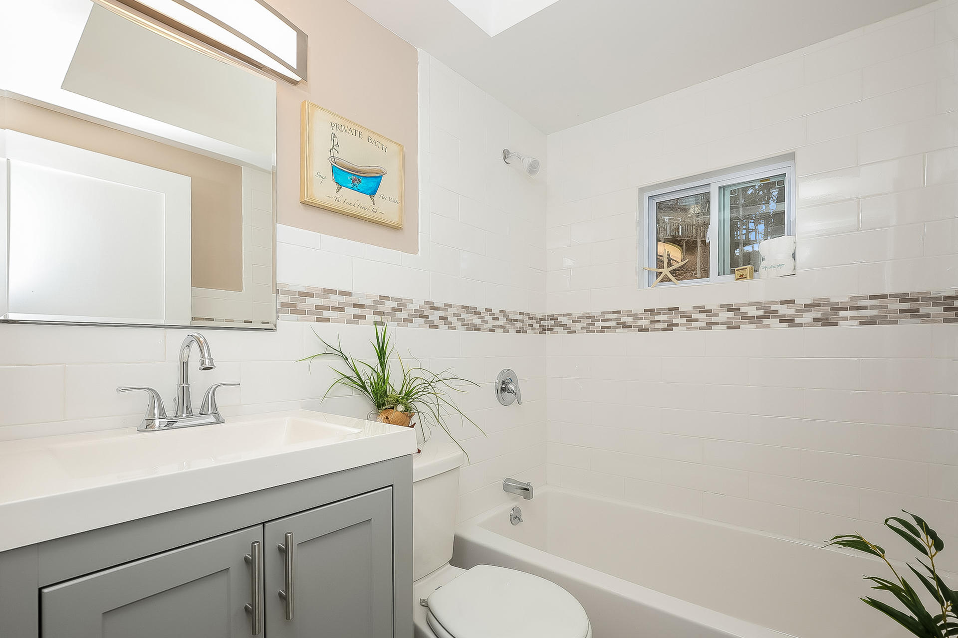 210 Chequessett Neck Road, Unit A Wellfleet, MA 02667 - Photo 18 of 33 a bathroom with a sink and a mirror