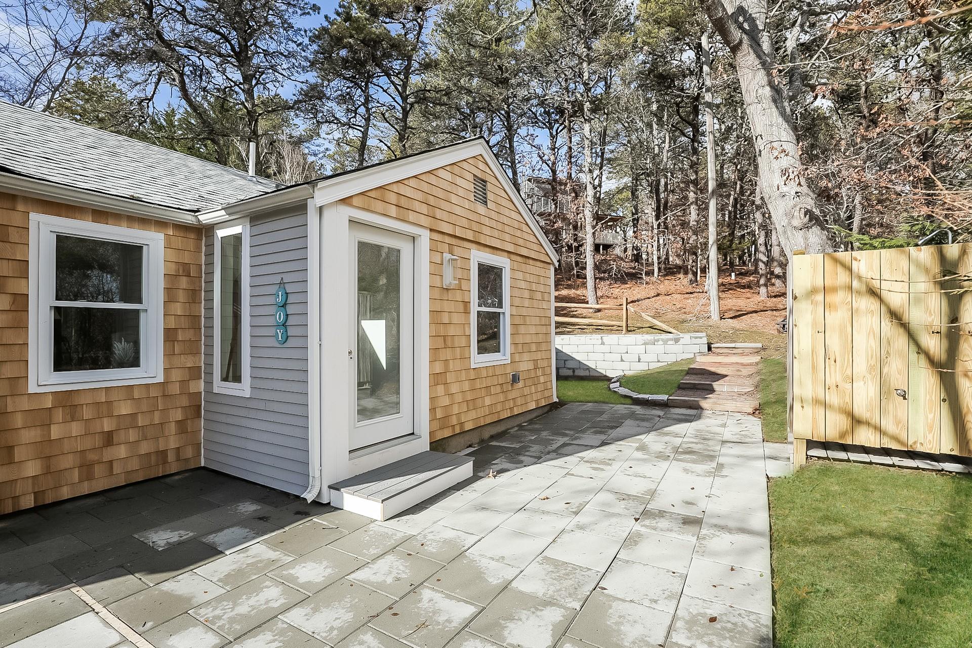 210 Chequessett Neck Road, Unit A Wellfleet, MA 02667 - Photo 3 of 33 a view of a house with a yard