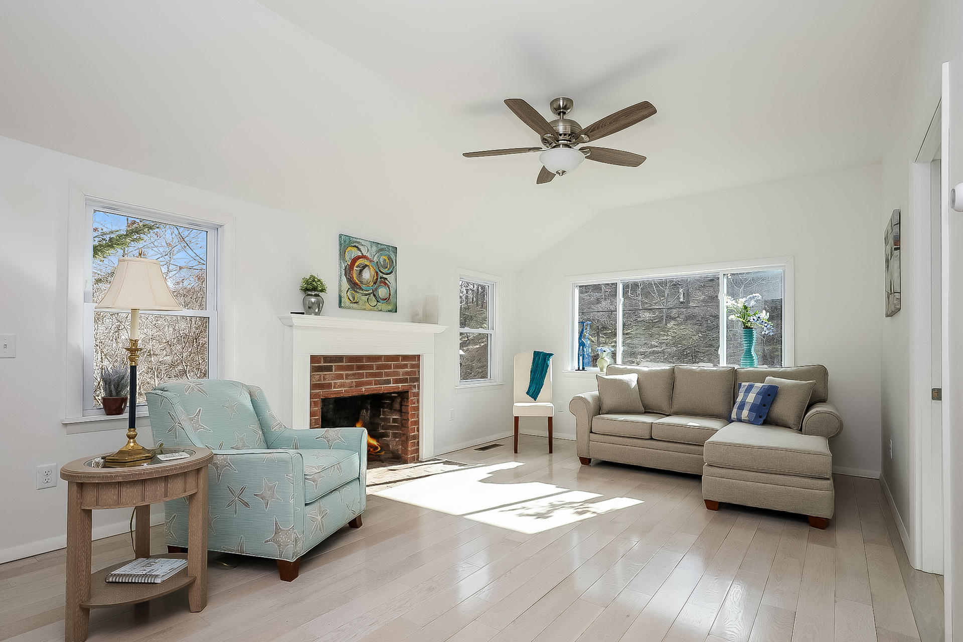 210 Chequessett Neck Road, Unit A Wellfleet, MA 02667 - Photo 5 of 33 a living room with furniture and a fireplace