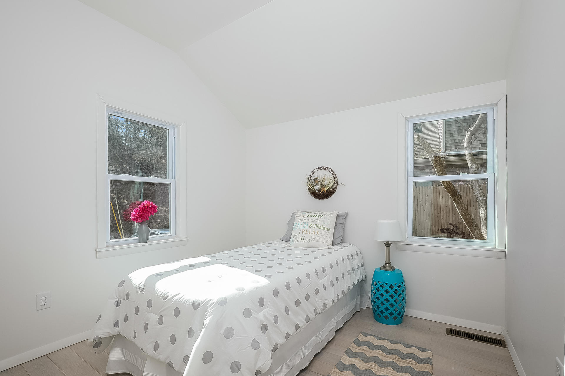 210 Chequessett Neck Road, Unit A Wellfleet, MA 02667 - Photo 10 of 33 a bedroom with a bed and a window