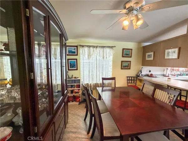a view of a dining room with furniture and chandelier
