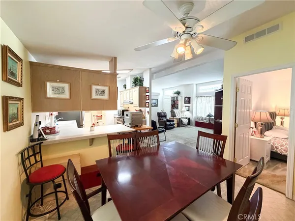 a view of a livingroom with furniture and a window
