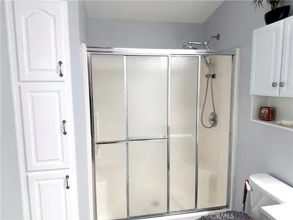 a kitchen with a refrigerator and a sink