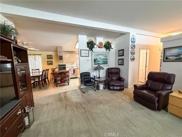 a kitchen with a refrigerator and a sink