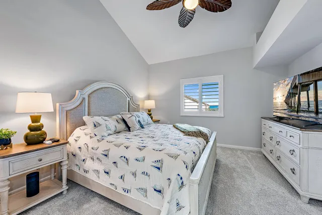 a bedroom with a bed and a dresser in it