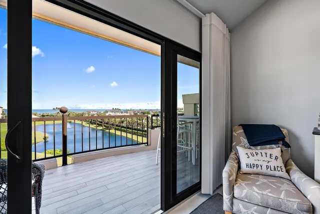 a balcony with furniture and wooden floor
