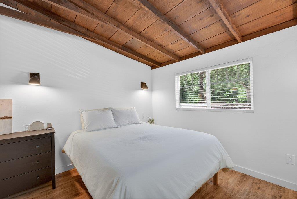 125 Shadowbrook Road Ben Lomond, CA 95005 - Photo 32 of 60 a bedroom with a bed and a window