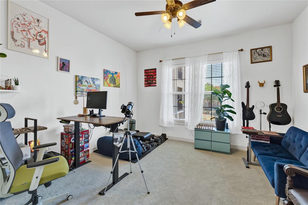 610 Via Ravello, Unit 207 Irving, TX 75039 - Photo 14 of 34 a view of a livingroom with workspace and a couch