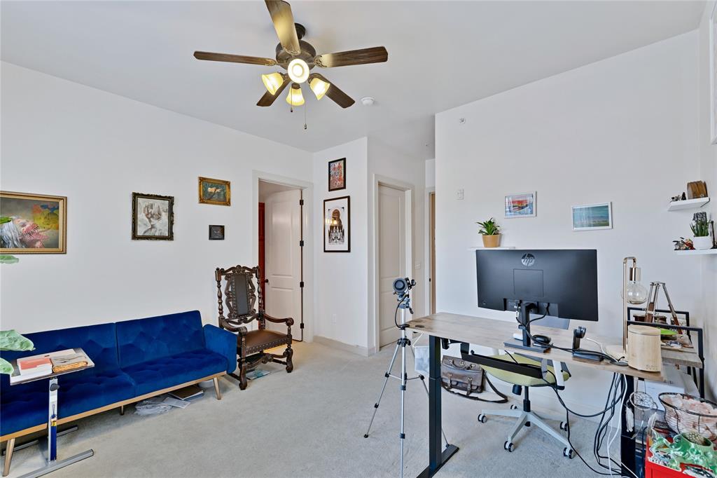 610 Via Ravello, Unit 207 Irving, TX 75039 - Photo 15 of 34 a view of a livingroom with workspace and a couch