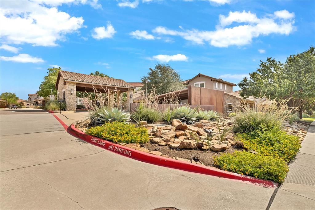 610 Via Ravello, Unit 207 Irving, TX 75039 - Photo 22 of 34 a view of a street with a flower garden