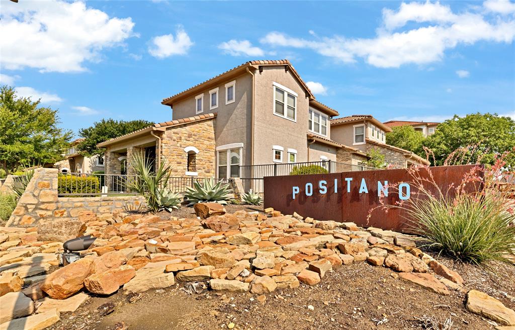 610 Via Ravello, Unit 207 Irving, TX 75039 - Photo 25 of 34 a blue sign board with buildings in the background