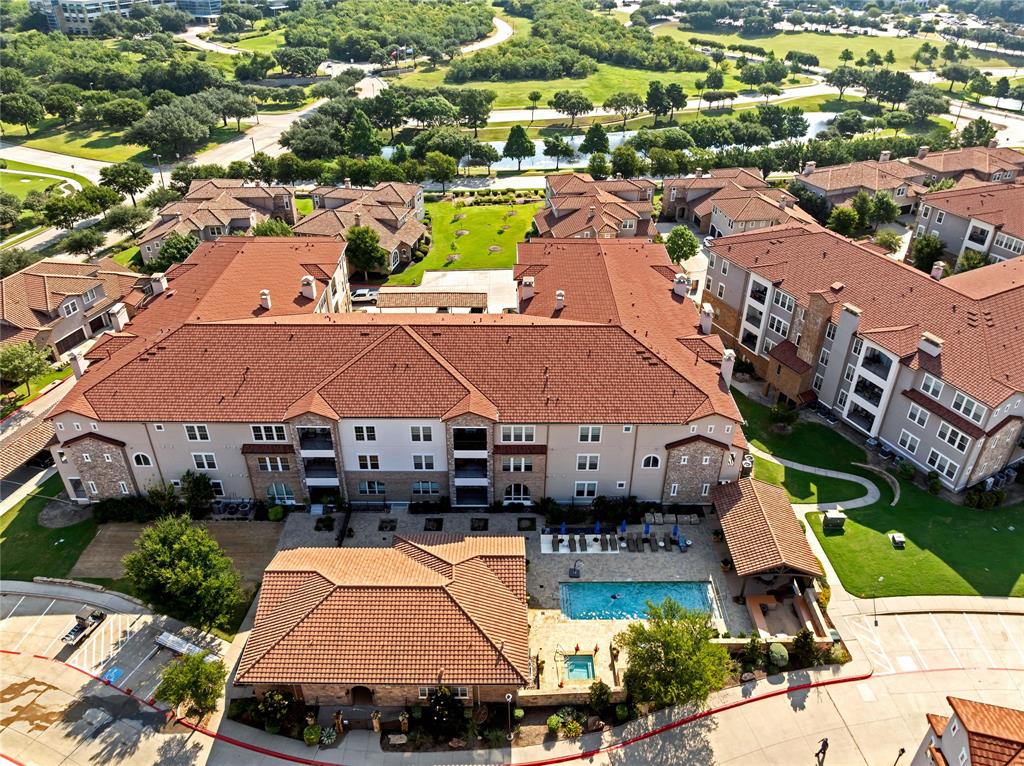 610 Via Ravello, Unit 207 Irving, TX 75039 - Photo 31 of 34 an aerial view of a house with swimming pool patio and lake view