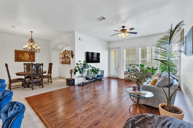 a living room with furniture potted plant and a window