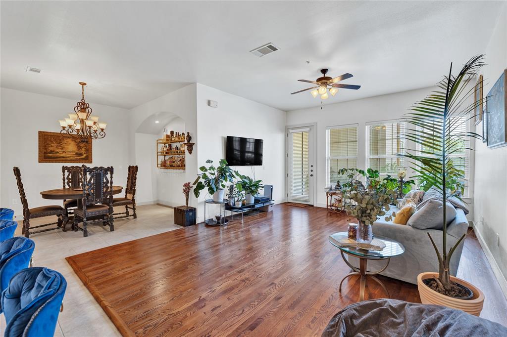 610 Via Ravello, Unit 207 Irving, TX 75039 - Photo 4 of 34 a living room with furniture potted plant and a window