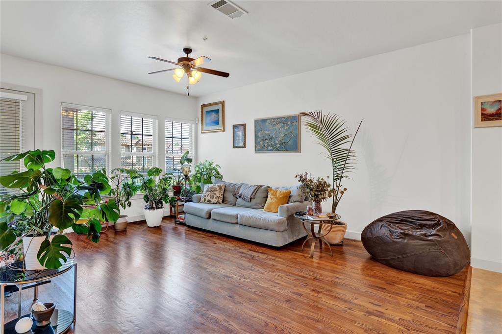 610 Via Ravello, Unit 207 Irving, TX 75039 - Photo 7 of 34 a living room with furniture and a large window