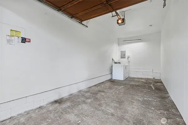 a view of a storage & utility room with refrigerator