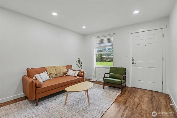 a living room with furniture and a rug