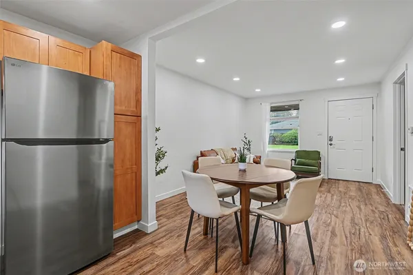 a view of a dining room with furniture window and wooden floor