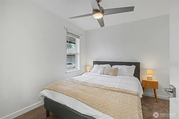 a bedroom with a bed and window