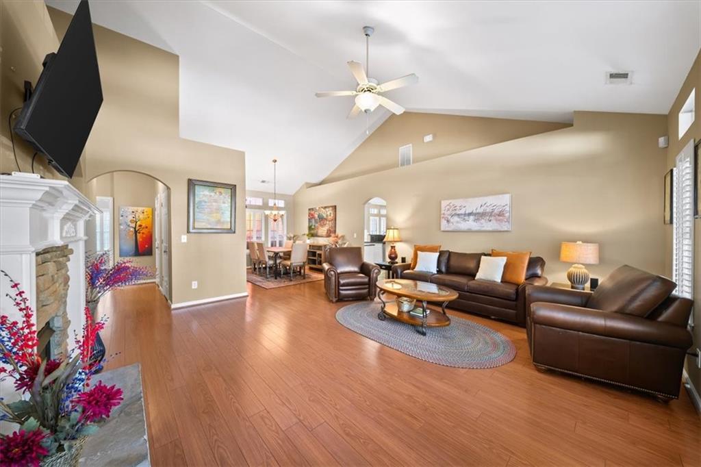 701 Redwood Pass Canton, GA 30114 - Photo 12 of 45 a living room with furniture and a chandelier