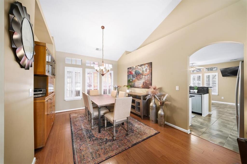 701 Redwood Pass Canton, GA 30114 - Photo 14 of 45 a view of a dining room with furniture window and wooden floor