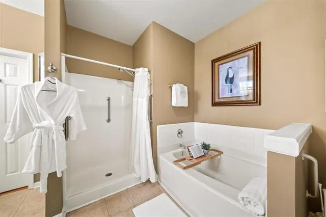 a bathroom with a tub and shower