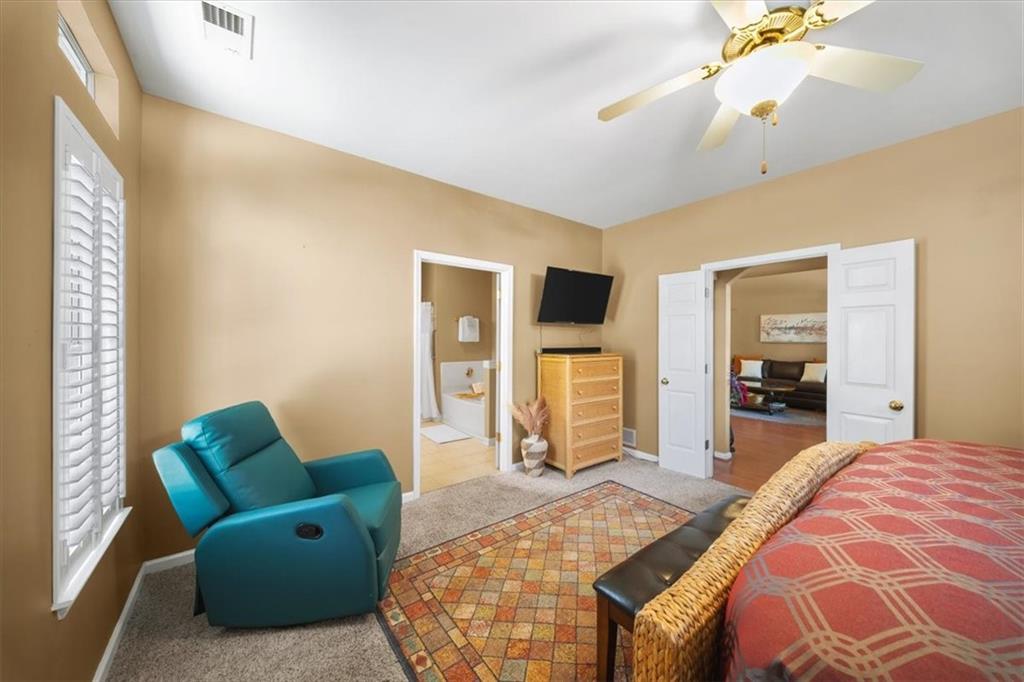 701 Redwood Pass Canton, GA 30114 - Photo 20 of 45 a bedroom with a bed mirror and window