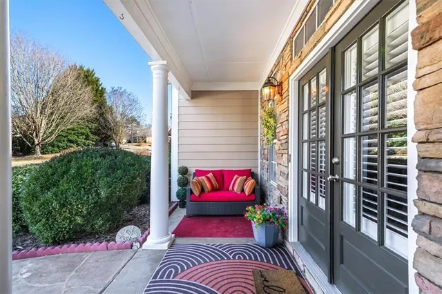 a view of balcony with couch and potted plants