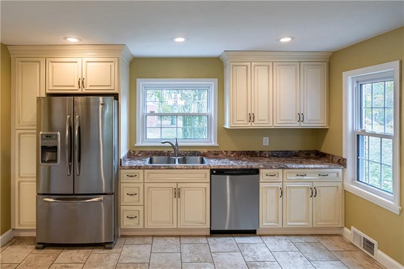 4578 Middle Road Allison Park, PA 15101 - Photo 9 of 25 The updated kitchen overlooking the dining room is highlighted by ceramic floors, stainless appliances, pantry and plenty of counter space.