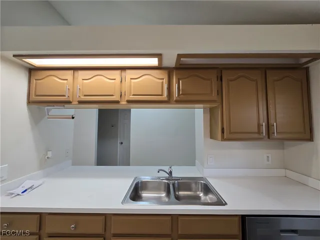 a kitchen that has a sink and a stove