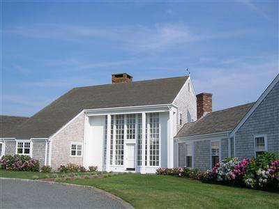 174 Eastward Road Chatham, MA 02633 - Photo 3 of 21 a front view of a house with a garden