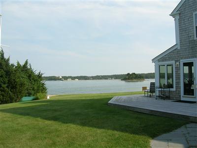 174 Eastward Road Chatham, MA 02633 - Photo 7 of 21 a view of a lake with outdoor space and porch