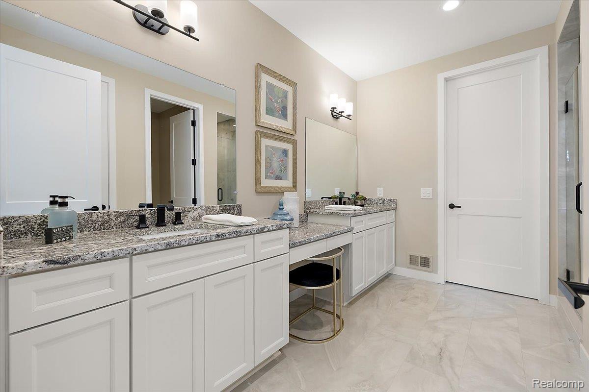 2032 Breckenridge Court, Unit 9 Rochester, MI 48309 - Photo 21 of 39 Full bathroom featuring a stall shower and vanity
