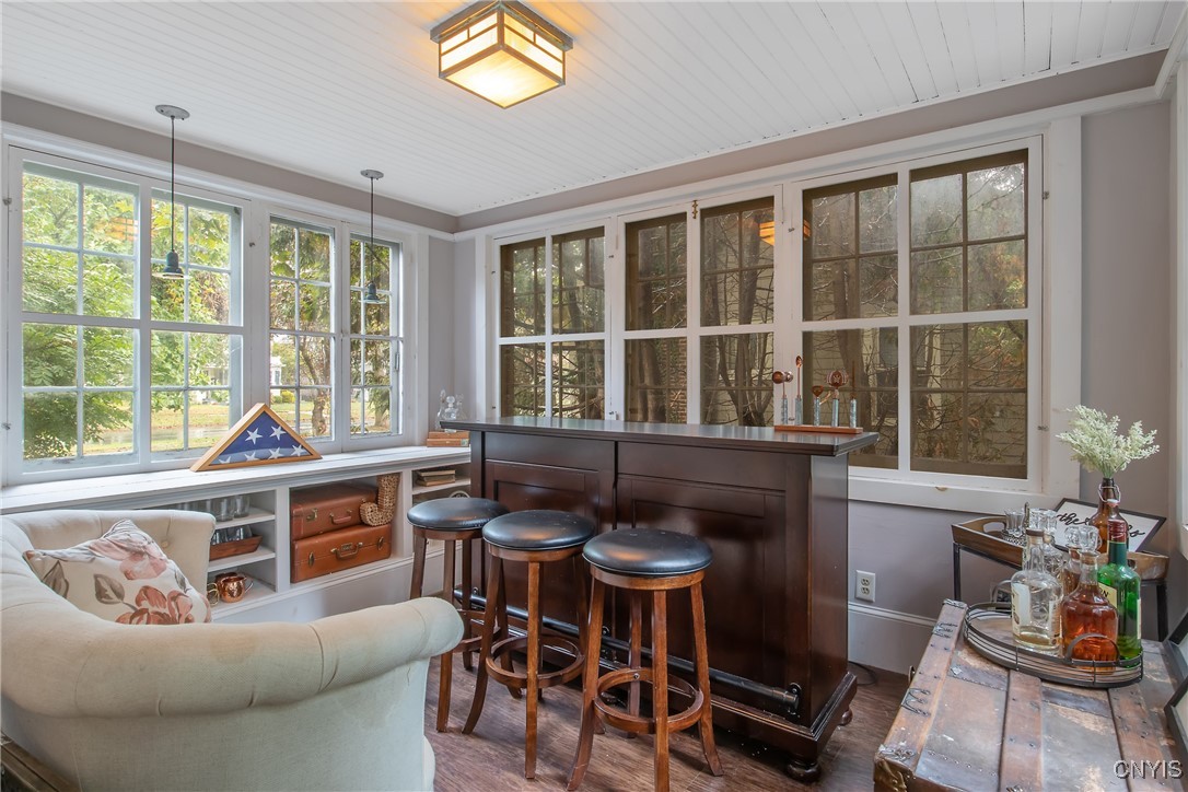 1205 North James Street Rome, NY 13440 - Photo 10 of 43 Heated sunroom with lots of windows letting in loa