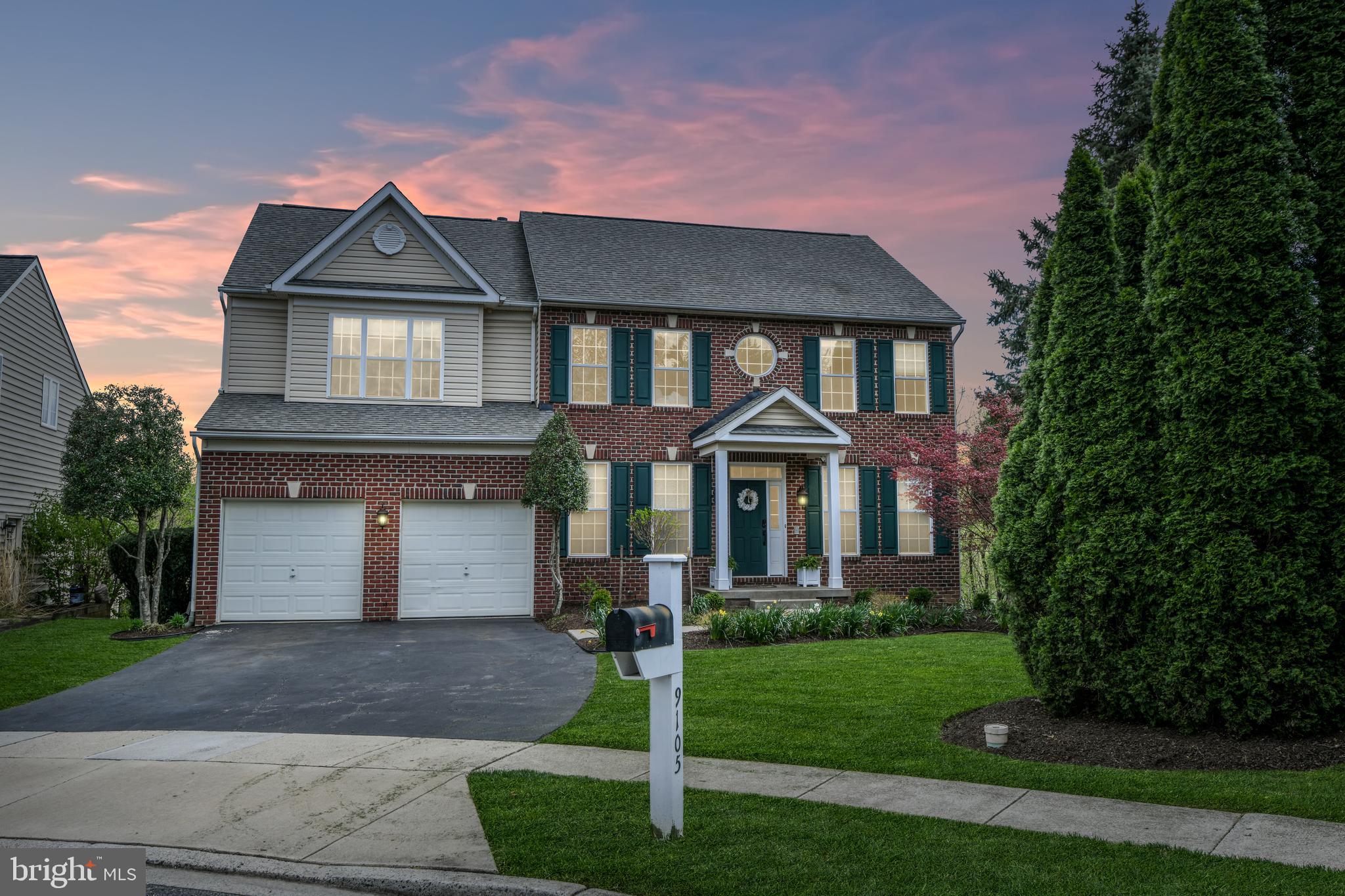 9105 Hendry Terrace Frederick, MD 21704 - Photo 1 of 51 a front view of a house with a yard and garage